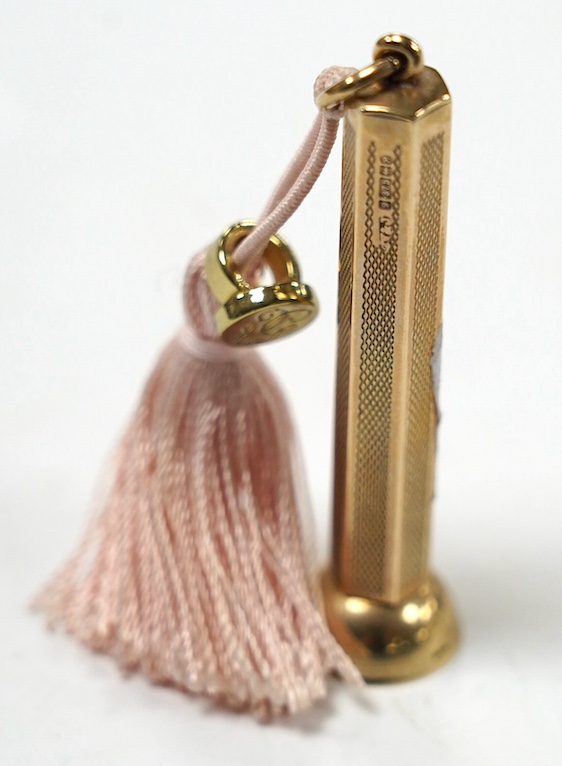A modern engine turned 9ct gold cigar piercer, overall 67mm, gross weight 15.8 grams. Condition - fair